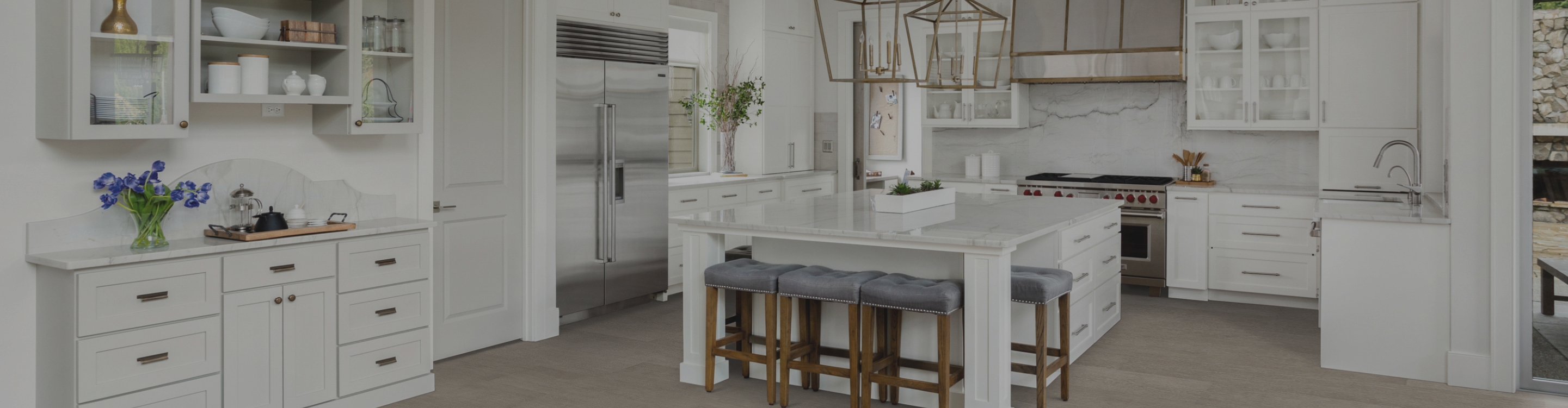 Kitchen with wood-look floors and white countertops and cabinetry