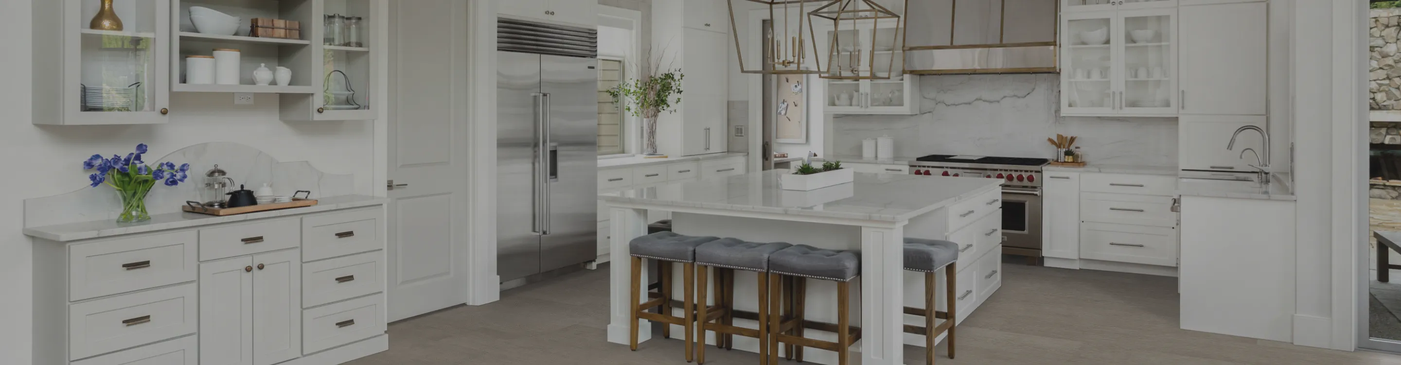 Kitchen with wood-look floors and white countertops and cabinetry
